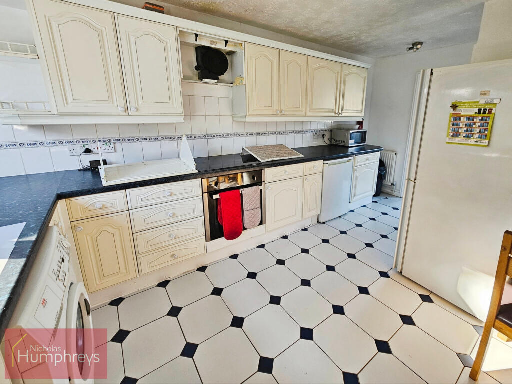 Shared kitchen with white cabinets in Hatfield house share